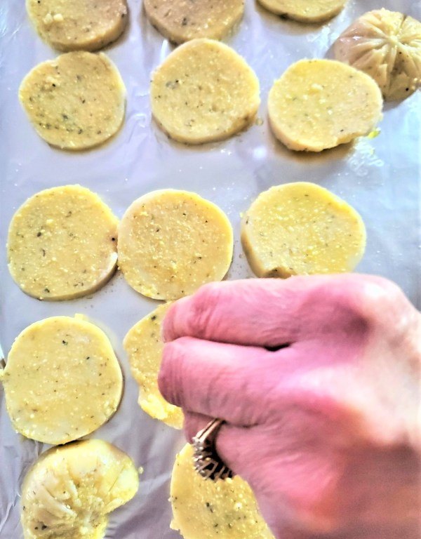 easy delicious baked parmesan polenta chips recipe, sprinkling polenta chips with sea salt