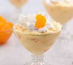 easy mandarin orange dessert with 3 ingredients, mandarin dessert made with 3 ingredients served in a vintage glass dish and topped with whipped cream and a mandarin orange slice