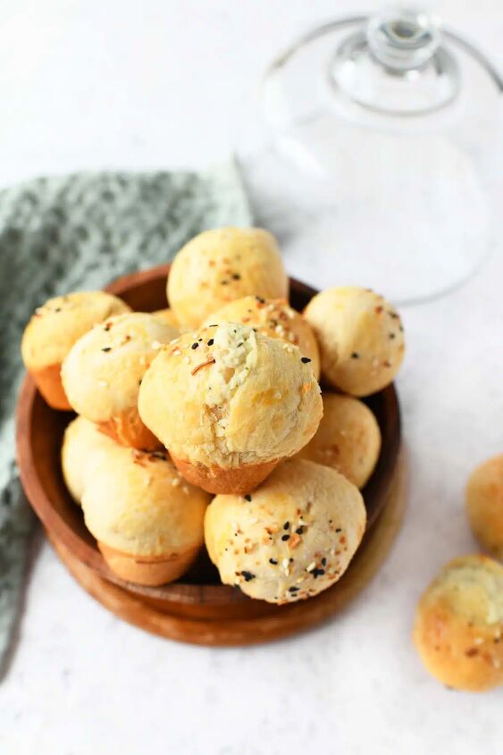 cream cheese stuffed biscuit bites, A wooden bowl of mini cream cheese stuffed biscuit bites