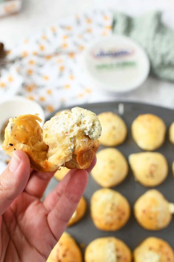 cream cheese stuffed biscuit bites, Alouette biscuits in a white hand