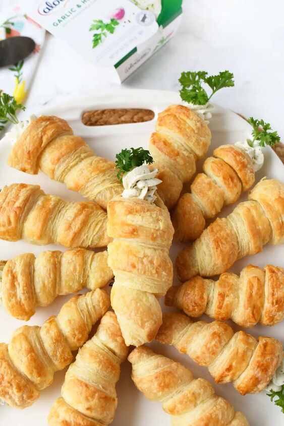 carrot shaped puff pastry appetizers, Puff pastry carrot appetizers on a white tray