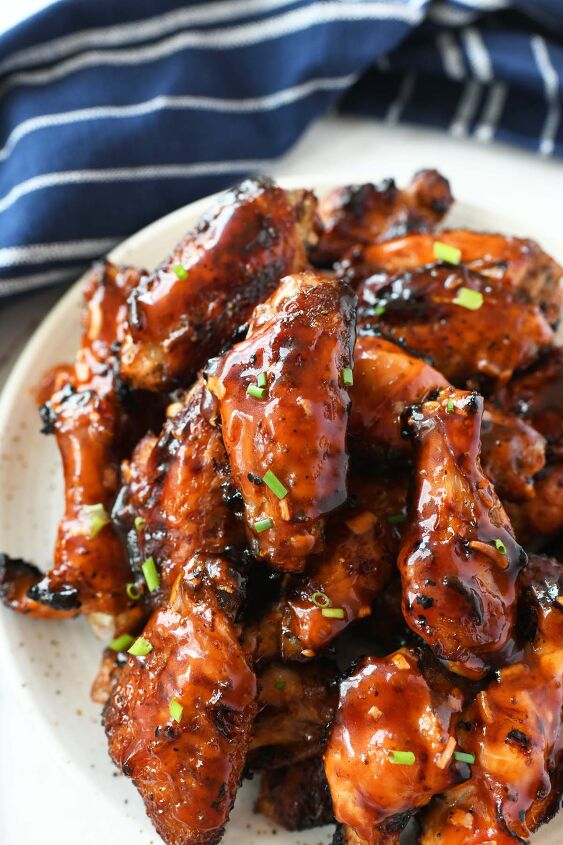 easy apricot sticky wings, Apricot sticky chicken wings on a white plate with a blue napkin