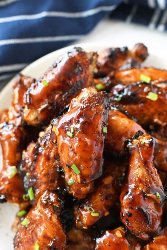 easy apricot sticky wings, Apricot Sweet Sticky Wings on a white plate with a blue napkin