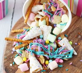 unicorn party snack mix, colorful unicorn snack mix spilling out of striped paper cup
