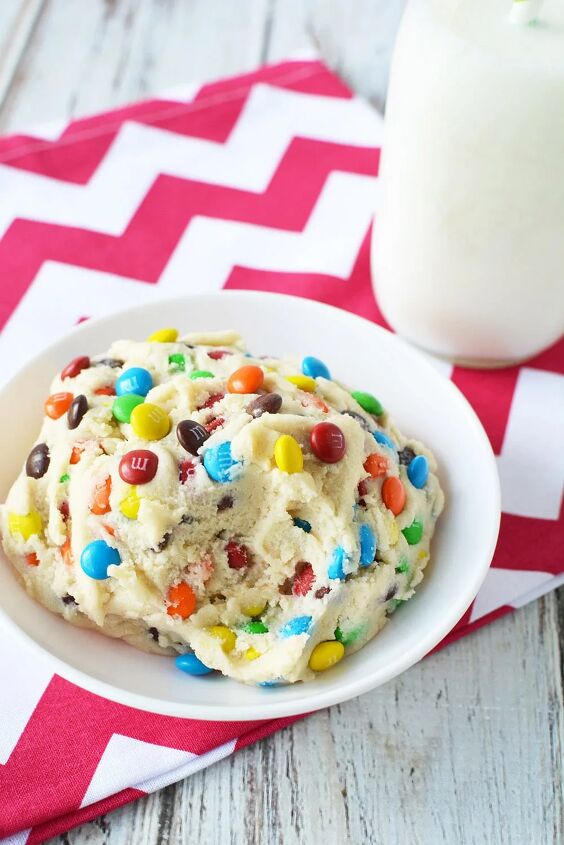no bake cookie dough with m m candies, Bowl of cookie dough with a spoonful missing