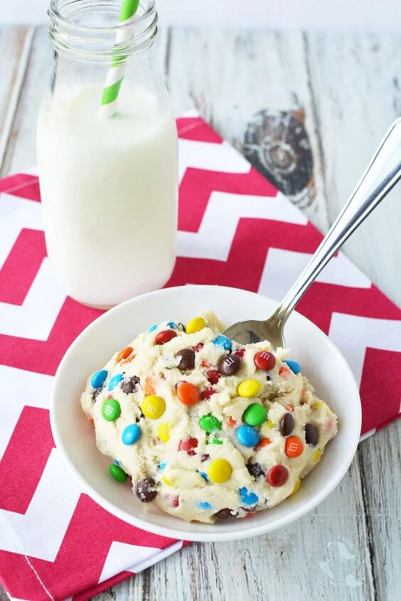 no bake cookie dough with m m candies, Cookie dough in a white bowl with a spoon and a glass of milk