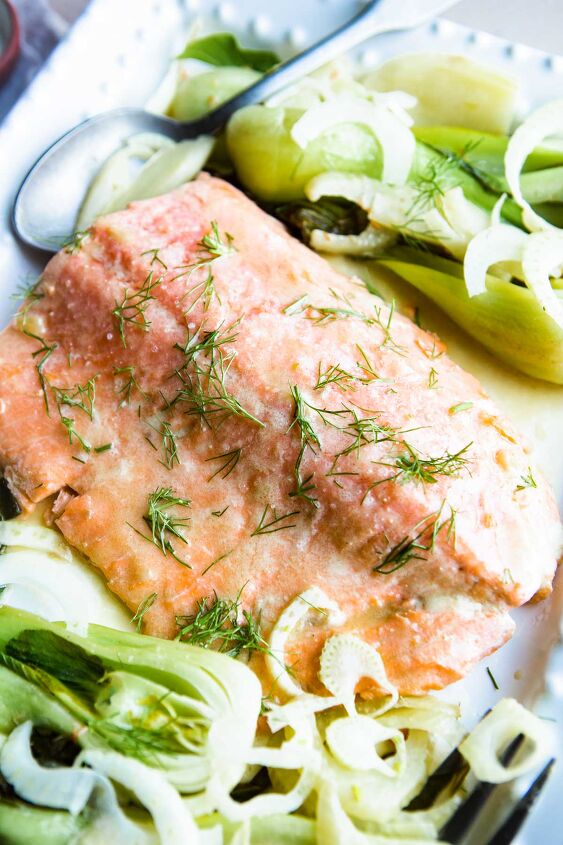 miso butter salmon quick easy, miso butter salmon garnished with cooked fennel and baby bok choy on a white platter