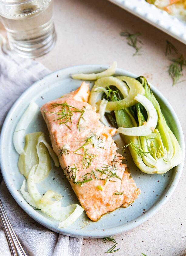 miso butter salmon quick easy, small piece of salmon on a plate with baby bok choy and fennel