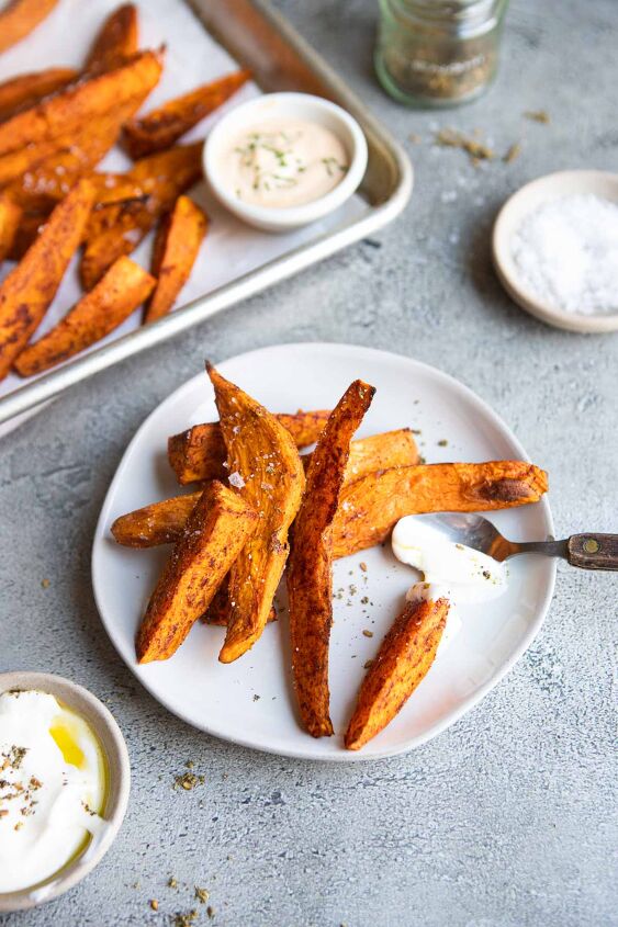 air fryer sweet potato wedges, air fryer sweet potato wedges on a white plate served with dipping sauce
