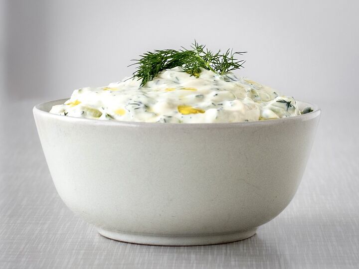 tzatziki, A bowl filled with tzatziki garnished with dill