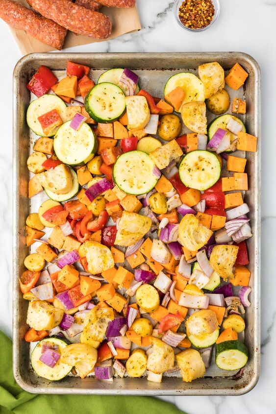 sheet pan sausage and veggies, All ingredients for recipe on a sheet pan except the sausage