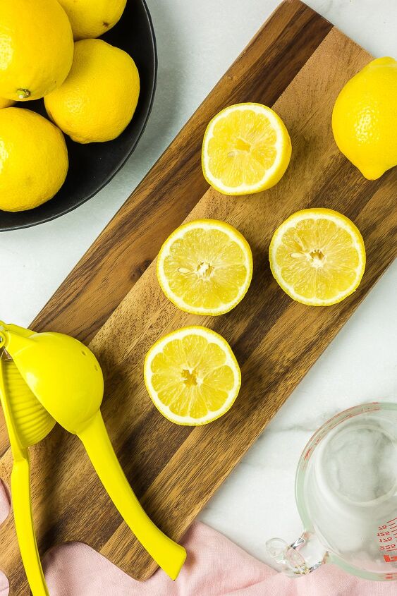 fresh squeezed lemonade, Lemons cut on a cutting board to make lemonade