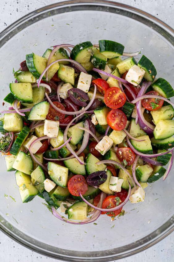 easy greek cucumber salad with feta, Cucumber salad in a large mixing bowl