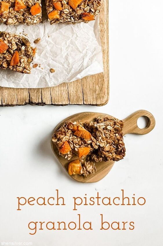yummy easiest peach pistachio granola bars, peach pistachio granola bar on a mini wooden cutting board