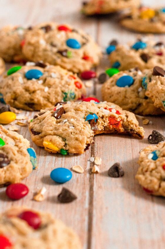 gluten free monster cookies vegan, Light golden brown monster cookies full of chocolate chips and brightly colored M M style chocolate candies