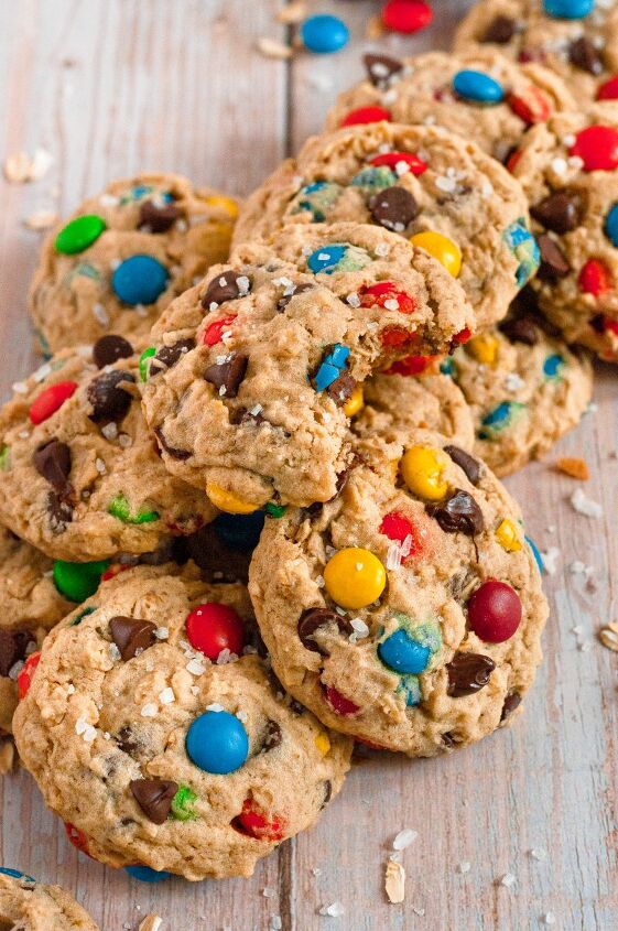 gluten free monster cookies vegan, Light golden brown monster cookies full of chocolate chips and brightly colored M M style chocolate candies