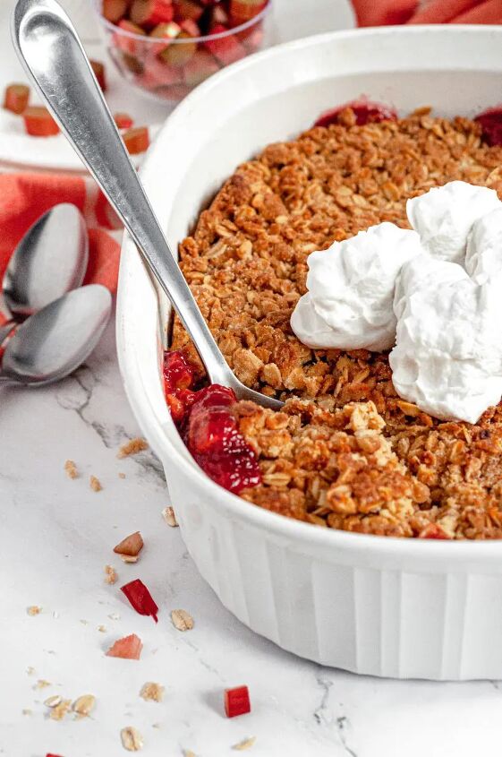 gluten free rhubarb crisp vegan, A delicious pink rhubarb crisp topped with golden brown oat crisp topping and served with fresh whipped cream