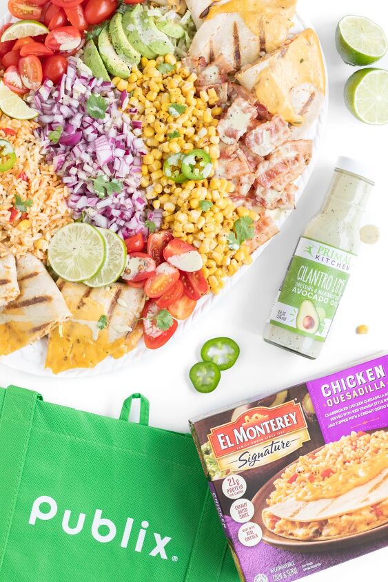 this family style quesadilla salad is better than restaurant versions, Over the top photo of large family salad reusable publix shopping bag el monterey quesadilla meal and primal kitchen lime and cilantro dressing