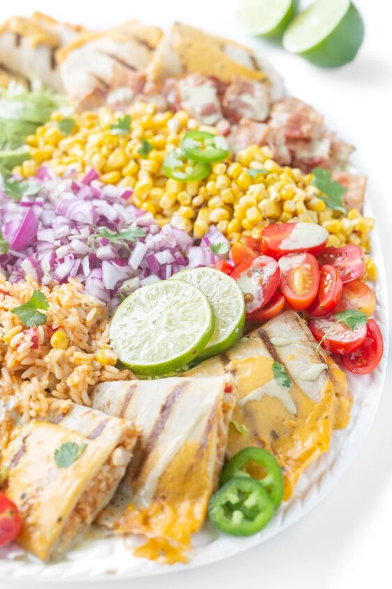 this family style quesadilla salad is better than restaurant versions, quesadilla salad with chicken quesadilla wedges lime slices mexican rice grape tomatoes corn bacon cilantro