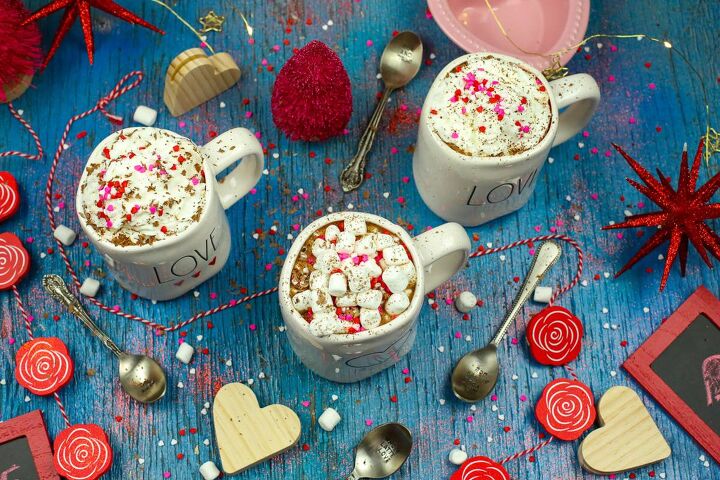 french vanilla hot chocolate with sweet cream valentine s day recipe, Three mugs of comforting hot chocolate with whipped cream and marshmallows