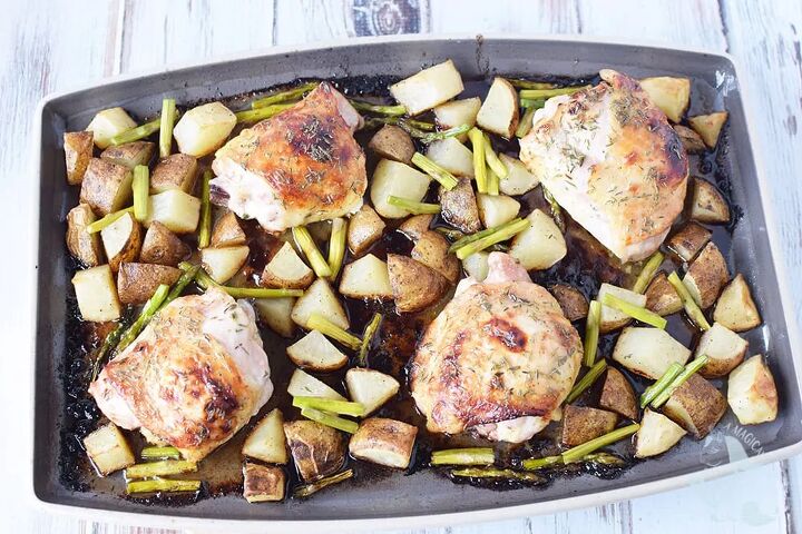 honey herb baked chicken thighs sheet pan dinner, Chicken thighs with vegetables and potatoes on a sheet pan