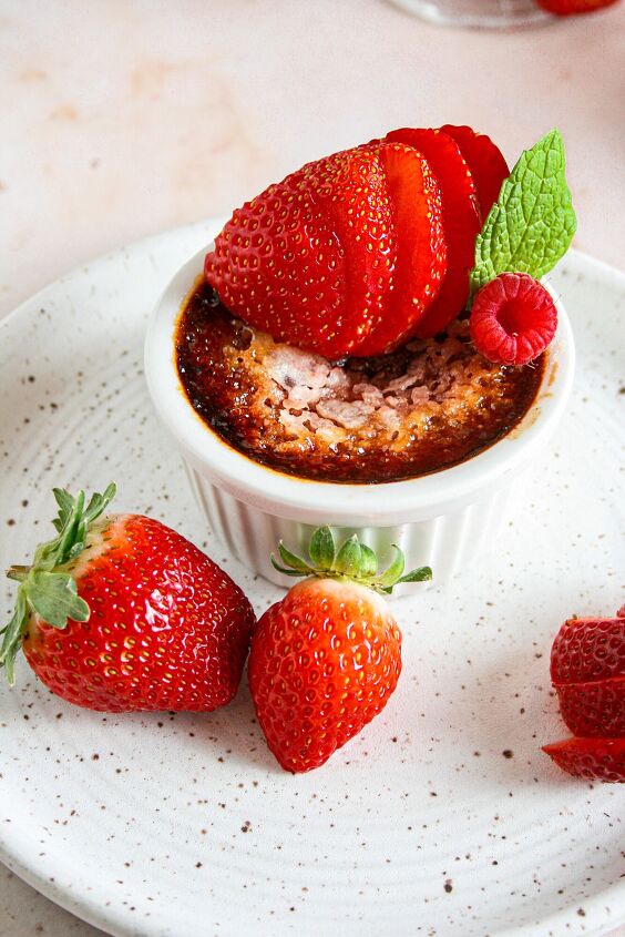 red velvet creme brulee, Red Velvet Creme brulee photographed on a white ceramic plate Garnished with strawberries