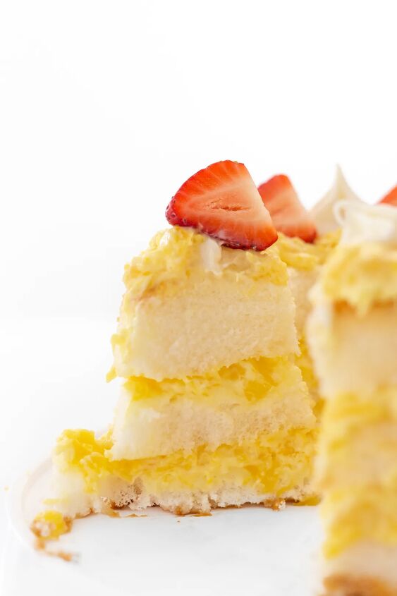 easy pineapple lush cake recipe, Sliced layered cake topped with fresh strawberries