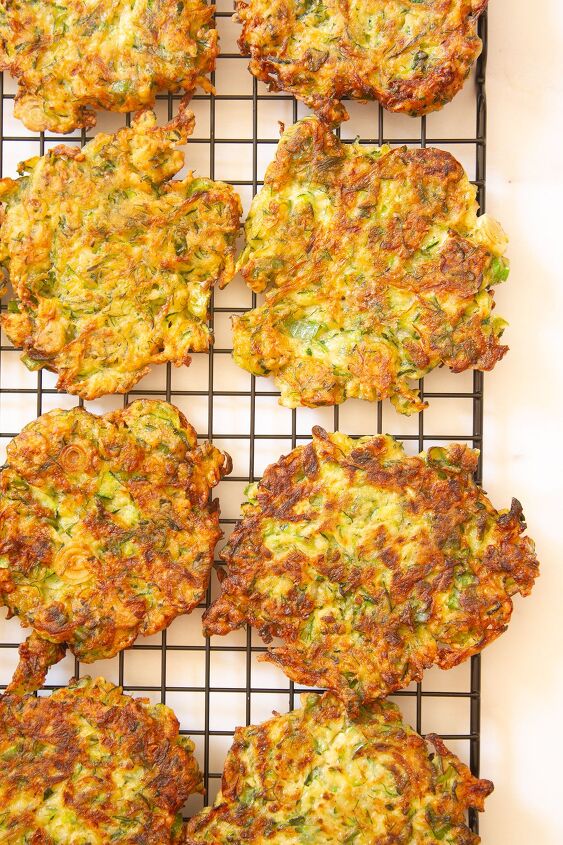 the best savoury zucchini pancakes courgette pancakes, The cooked pancakes on a wire rack