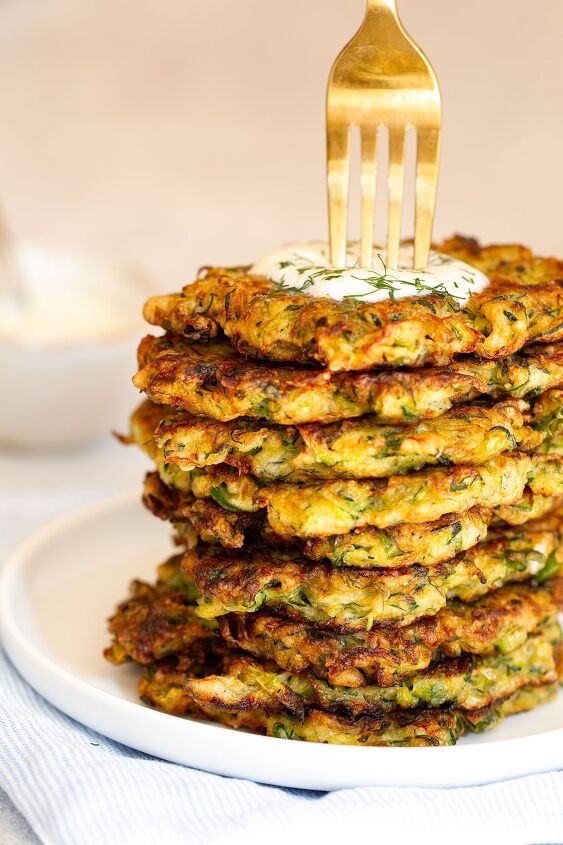the best savoury zucchini pancakes courgette pancakes, The cooked zucchini pancakes on a white plate
