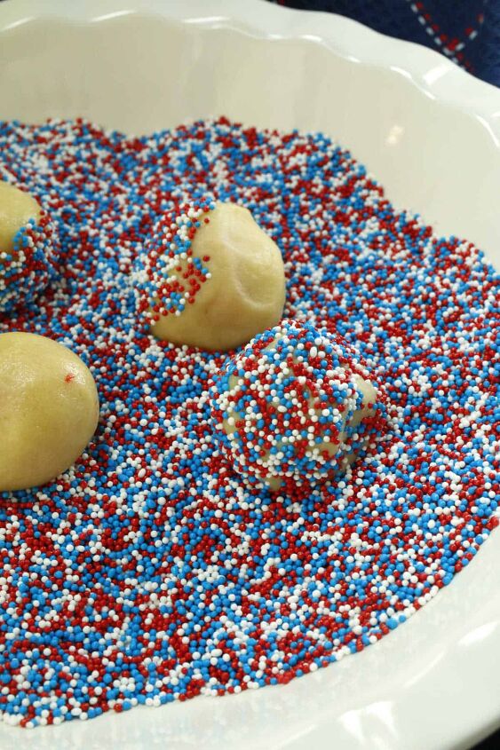 red white blue 4th of july cookies with sprinkles, Rolling balls of cookie dough in red white and blue sprinkles