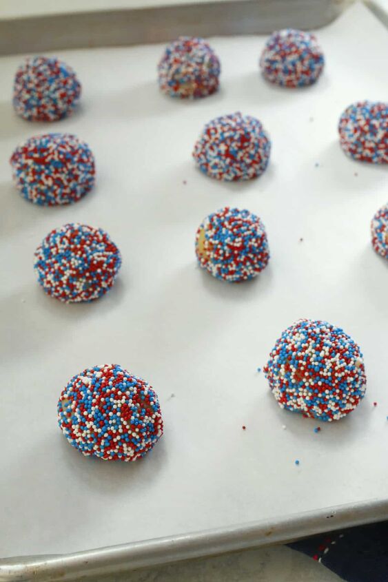 red white blue 4th of july cookies with sprinkles, Sprinkle covered cookie dough balls on a cookie sheet