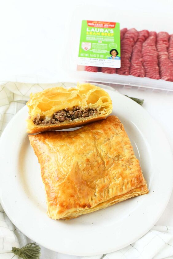easy cheesy beef onion potato puff pastry pockets, Golden brown beef pockets on a white plate