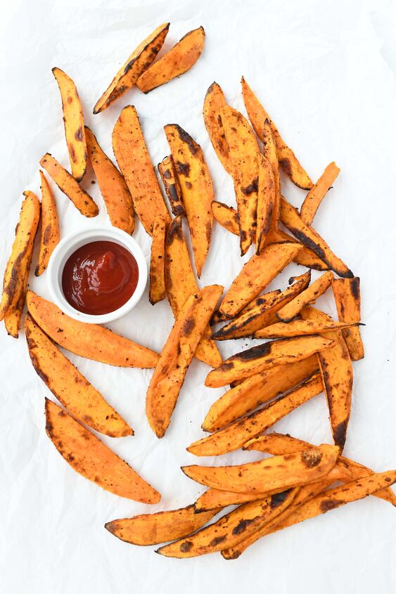 crispy air fryer sweet potato fries, Crispy sweet potato fries with a dish of red ketchup