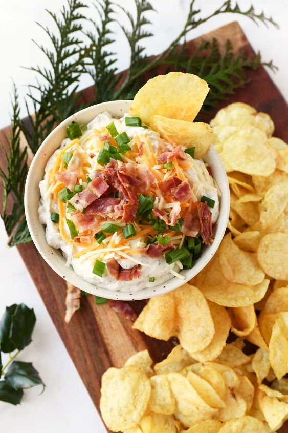 creamy loaded potato chip dip, Loaded creamy chip dip in a white bowl with bacon and cheese