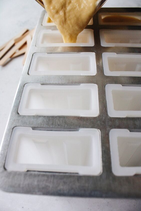 mango popsicles, mango popsicles mixture being pour into popsicle mold
