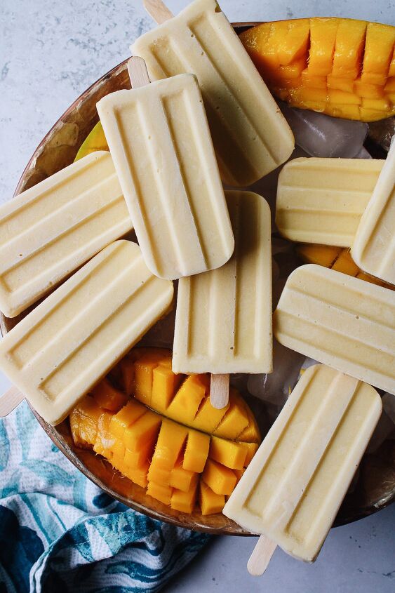 mango popsicles, mango popsicles on a bowl of ice