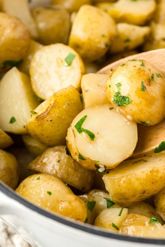 the best dutch oven potatoes stovetop, up close image of potatoes in a dutch oven