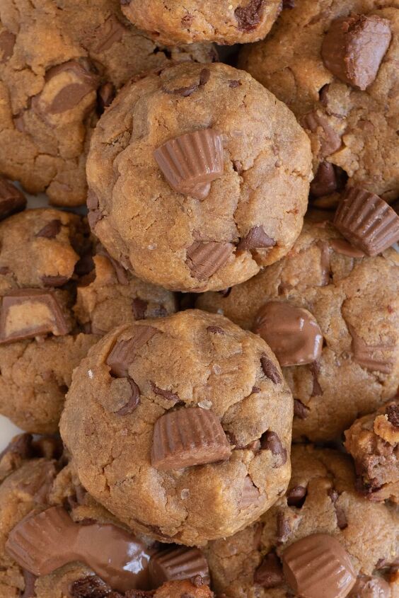 the peanut butter cup cookies recipe you ll make again and again, up close view of thick peanut butter cup cookies stacked together on a plate