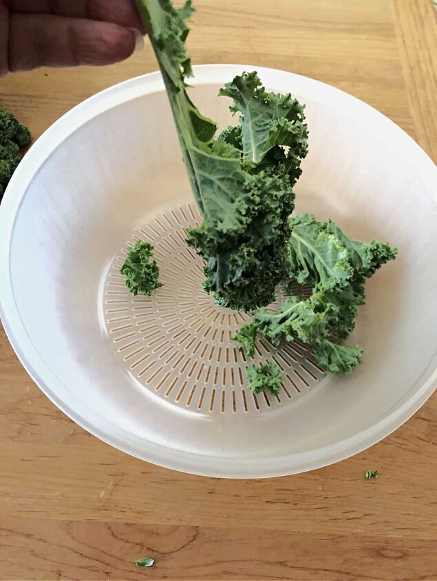 massaged kale, removing leaves from stems