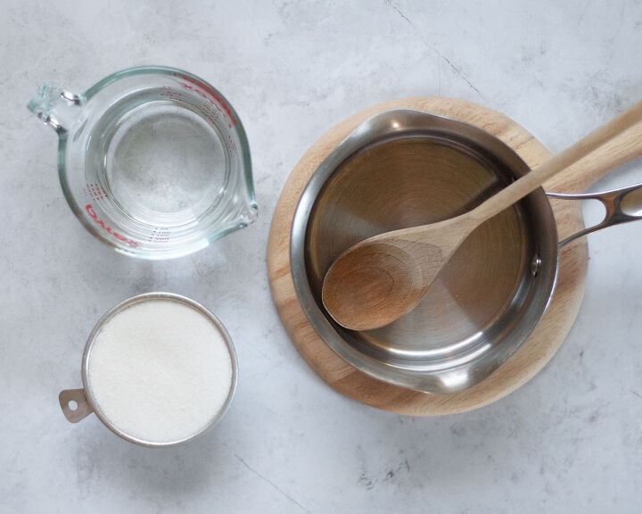 simple syrup, Ingredients and equipment to make homemade simple syrup Includes water sugar a small saucepan and a wooden spoon
