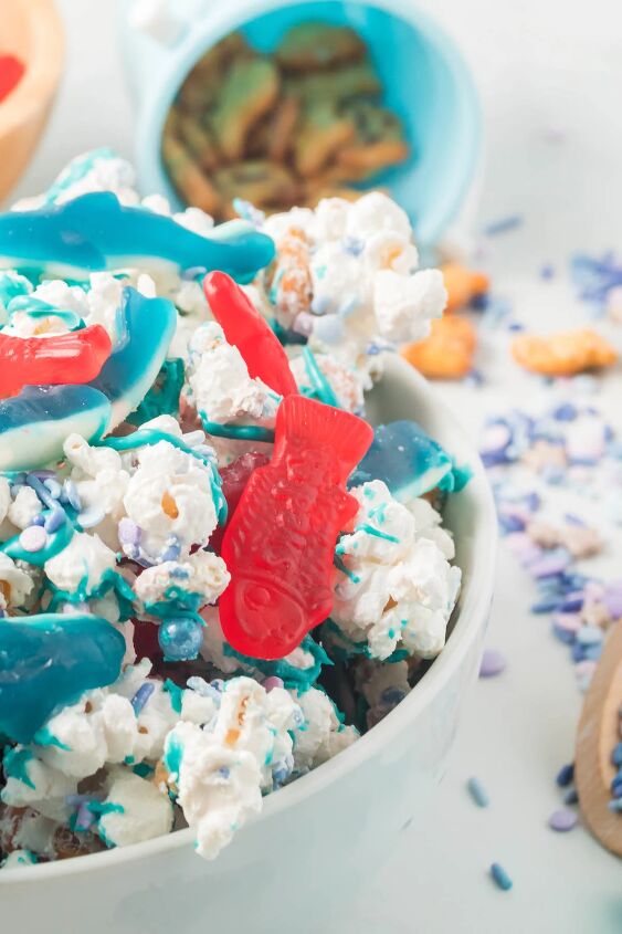 how to make shark bait snack mix, up close dish of shark bait snack mix with swedish fish and gummy sharks