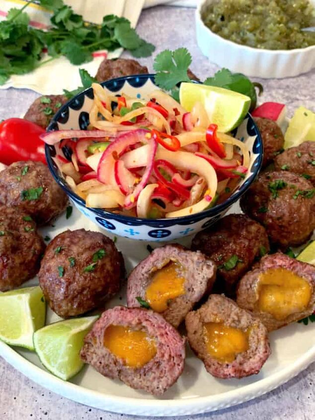 refrigerator bread and butter pickles, Mexican meatballs stuffed with cheese on a white plate