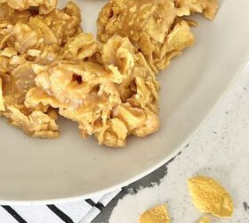 the best of the peanut butter cereal cookie recipes, A white plate full of peanut butter corn flake cookies