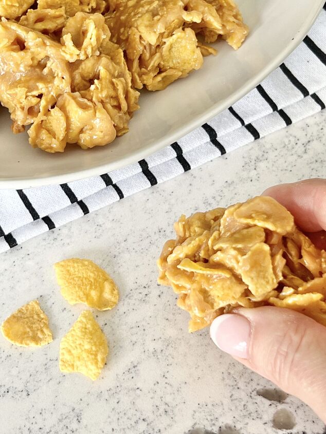 the best of the peanut butter cereal cookie recipes, cereal cookie recipes Grabbing a peanut butter corn flake cookie from a white plate
