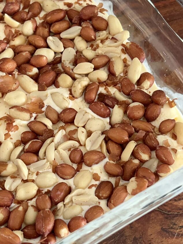 easy homemade buster bar ice cream dessert recipe, A layer of Spanish peanuts pressed into the ice cream layer of this Buster Bar recipe