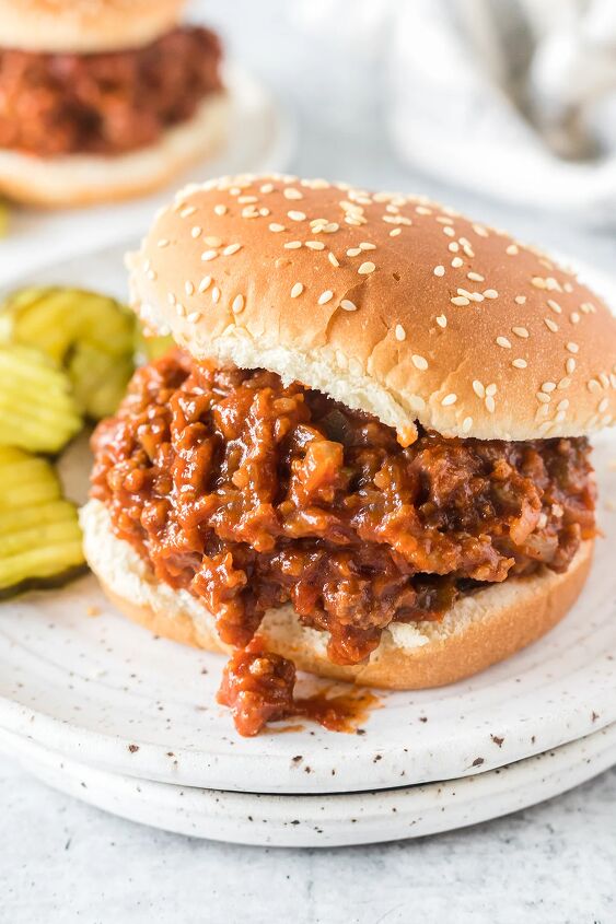 how to make classic sloppy joes with ketchup, classic sloppy joe served on a sesame bun with pickles on the side