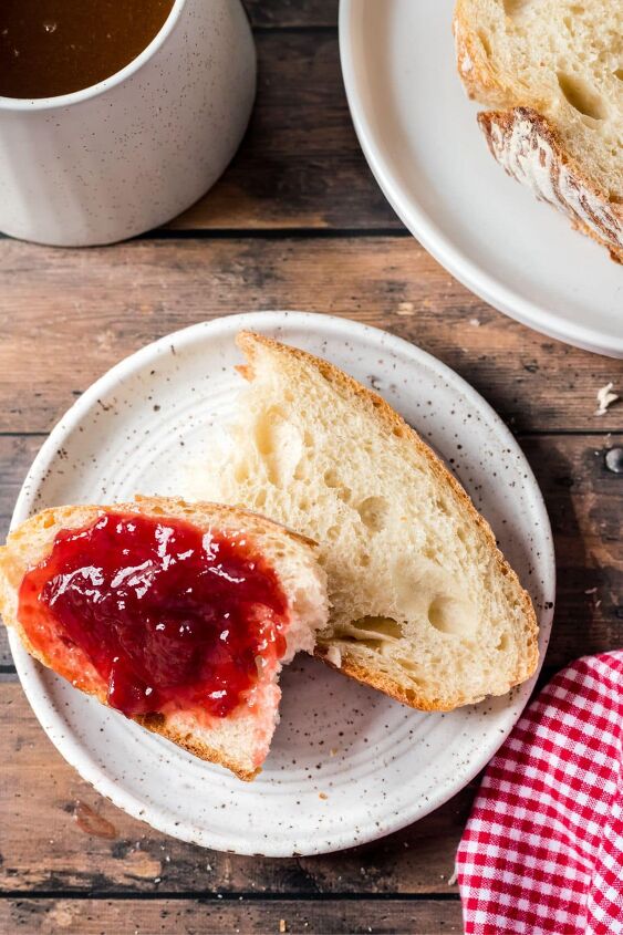 how to make dutch oven sourdough bread, Sliced sourdough bread sliced with strawberry jam spread on it