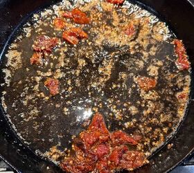 5 easy dinners with sun dried tomato cream sauce, cooking sun dried tomatoes and garlic in butter and olive oil in a cast iron skillet