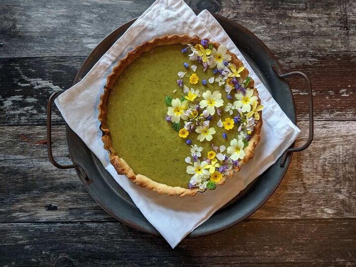 lemon nettle tart decorated with edible flowers