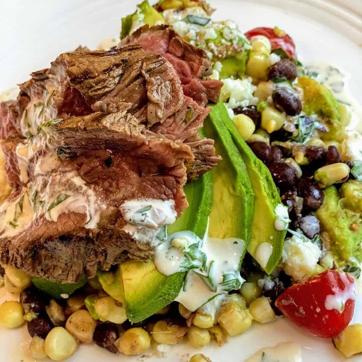 quick chimichurri carne asada, white plate with Carne Asada with Corn Salad and Chimichurri Sauce